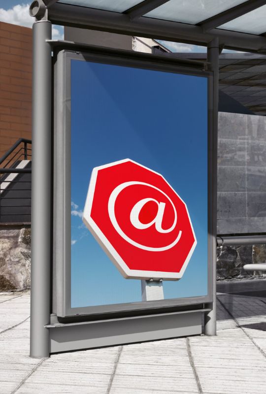 bus stop ad with an image of a red stop sign with an @ symbol