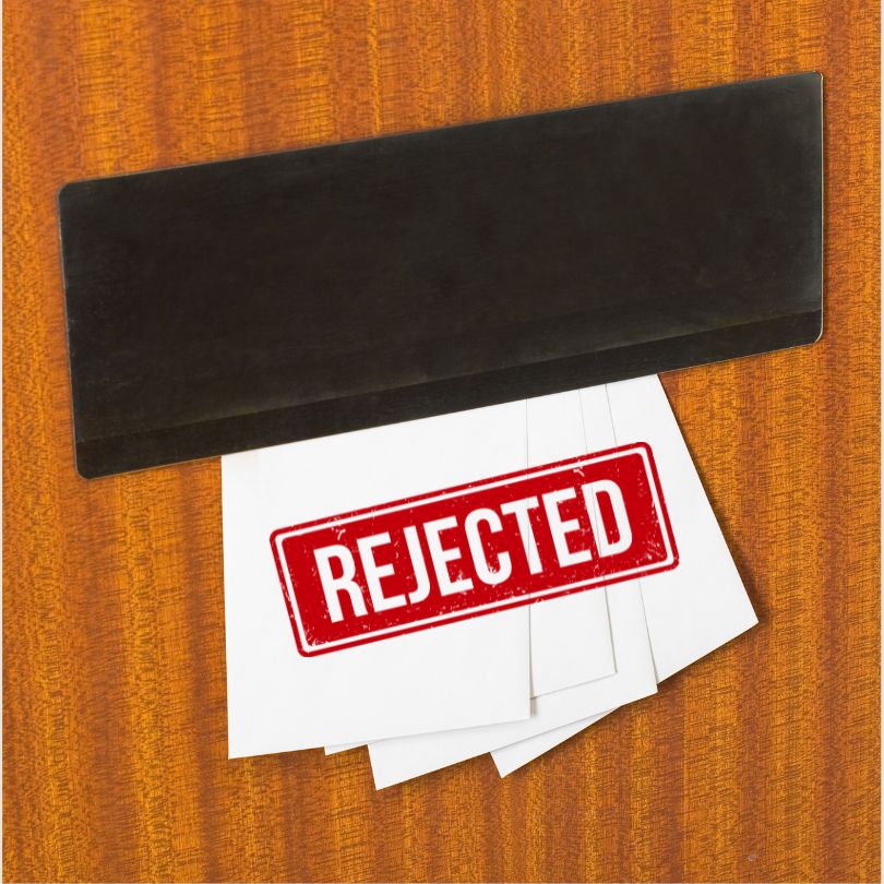 Mail slot with envelopes stamped 